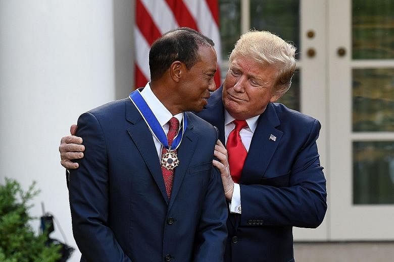 Tiger Woods thanking US President Donald Trump after receiving the Presidential Medal of Freedom at the White House on Monday. PHOTO: AGENCE FRANCE-PRESSE