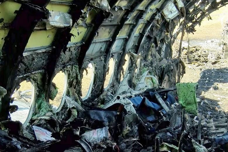 The razed interior of the Aeroflot Sukhoi Superjet passenger plane which crash landed at Moscow's Sheremetyevo airport and burst into flames. The accident on Sunday killed at least 40 people.