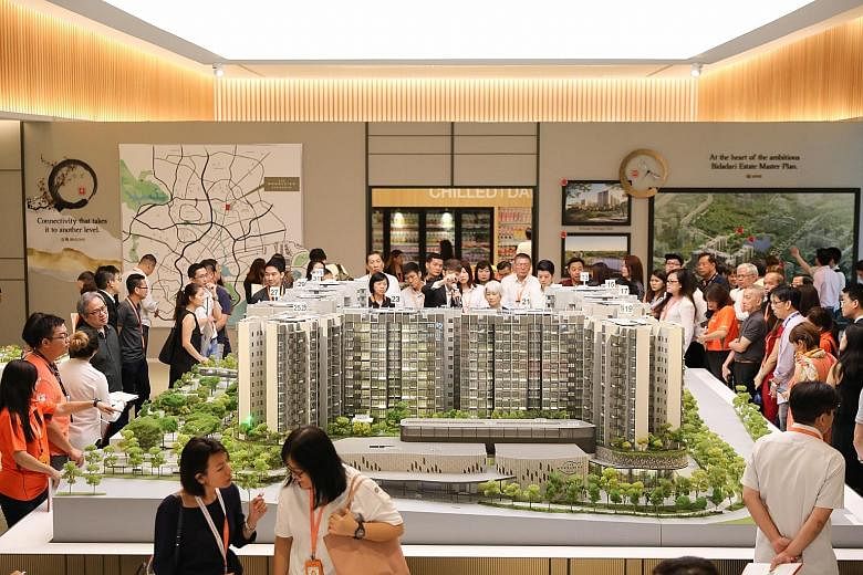 Visitors at a preview of The Woodleigh Residences yesterday, ahead of its launch on Saturday. The integrated development by Japanese developer Kajima Development and Singapore Press Holdings will include 667 residential units that feature Japanese te