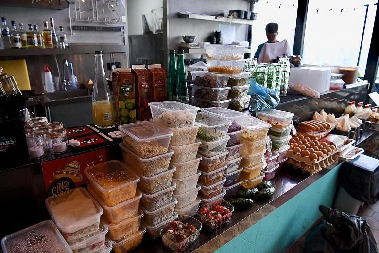At Lower East Side 45 restaurant, several boxes of raw ingredients for cooking, as well as eggs and strawberries that had turned bad, were taken out for disposal.