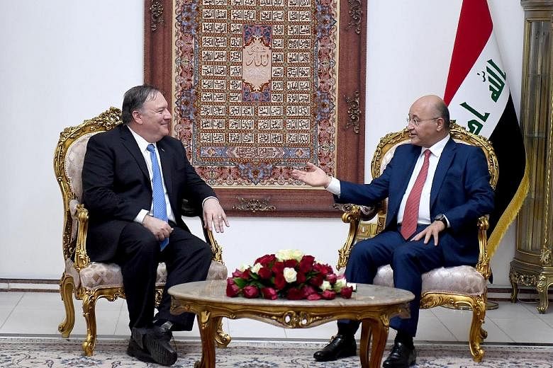 Iraqi President Barham Salih (right) during his meeting with US Secretary of State Mike Pompeo in Baghdad. The diversion to Iraq by Mr Pompeo, who was in the midst of a European tour, added to an escalating US effort to ostracise Iran.
