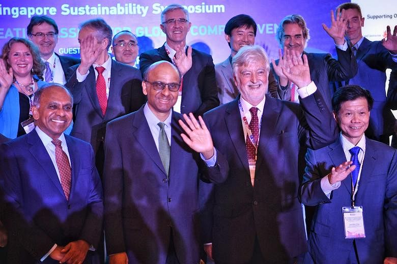 Senior Minister Tharman Shanmugaratnam - flanked by Nanyang Technological University president Subra Suresh (left) and Professor Alexander J. B. Zehnder, member of the university's board of trustees and chairman of its Sustainable Earth Office - with