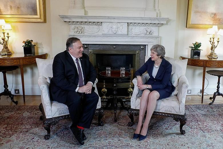 US Secretary of State Mike Pompeo with British Prime Minister Theresa May ahead of their bilateral meeting in London on Wednesday. He warned that China posed a wide range of economic and security threats.