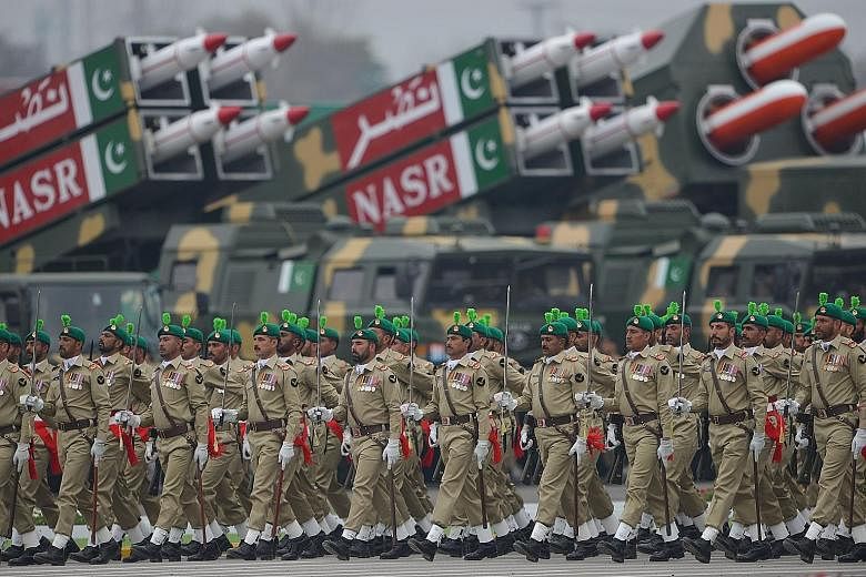 Troops marching during the Pakistan Day parade in Islamabad on March 23 this year. The Pakistani military does not tolerate dissent or criticism. PHOTO: AGENCE FRANCE-PRESSE