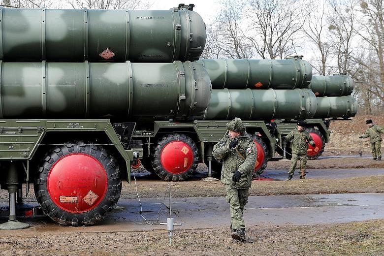 Russian servicemen next to a new S-400 Triumph surface-to-air missile system after its deployment at a military base outside a town near Kaliningrad in March. Instead of ordering the US-made Patriot, Turkish President Recep Tayyip Erdogan stunned his