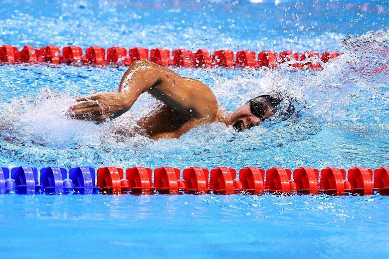 Toh Wei Soong clocking 1min 03.60sec in the 100m freestyle final at the OCBC Aquatic Centre last night. He had a multi-class score of 944 points that gave him the gold medal. ST PHOTO: LIM YAOHUI