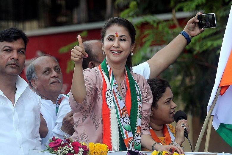 Former actress Urmila Matondkar, who joined India's main opposition Congress party, at her election rally in Mumbai last month. Indian actor and Bharatiya Janata Party candidate Sunny Deol (in pink), who is contesting the Gurdaspur parliamentary seat