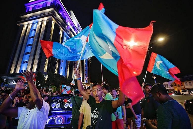 Supporters of Pakatan Harapan (PH) celebrating the coalition's win in Johor Baru last year. A recent Merdeka Centre survey showed that approval ratings for Prime Minister Mahathir Mohamad and PH have plunged since then, with only 24 per cent of Malay