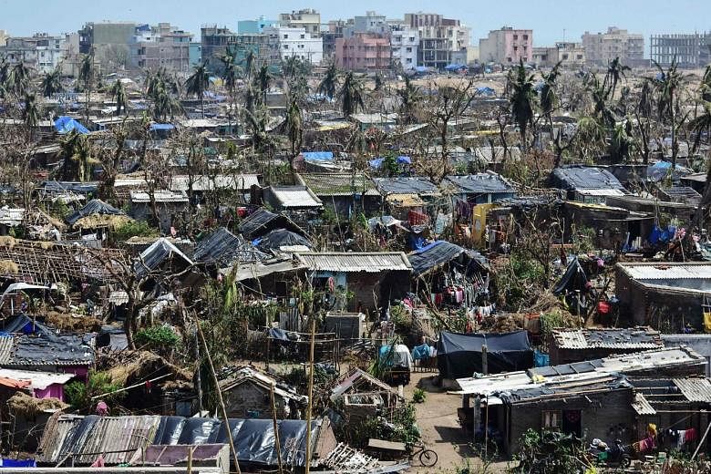 Damaged homes in Puri district in India's eastern Odisha state last Friday. Millions of people have been without power or water since Cyclone Fani made landfall on May 3. The death toll in India has risen to 64, with Puri recording the most number of