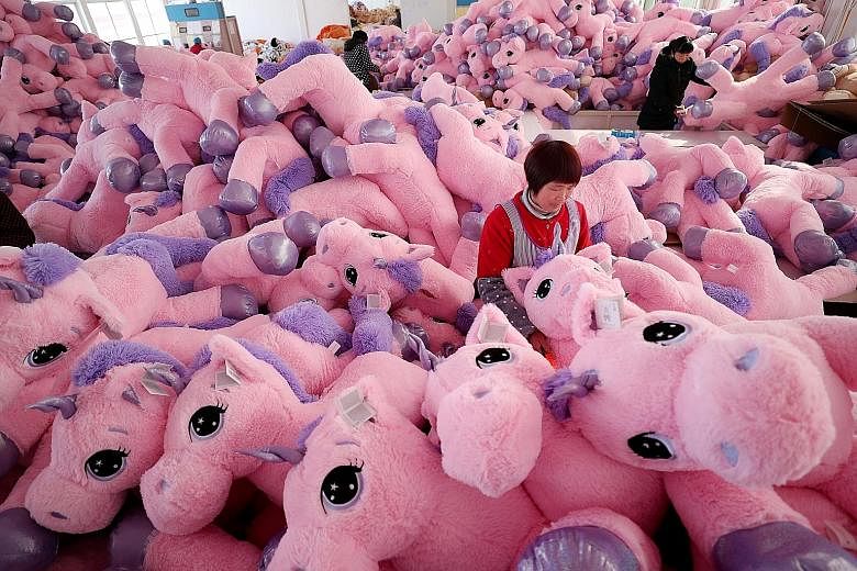 Workers making unicorn stuffed toys for export at a workshop in Lianyungang, in China's Jiangsu province. The US Trade Representative's office on Monday released a list of another US$300 billion worth of Chinese goods, including children's clothing, 