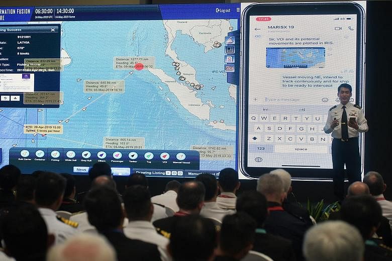 Senior Minister of State for Defence Maliki Osman speaking to delegates from China during the launch of the Information Fusion Centre's Iris portal, held in conjunction with the centre's 10th anniversary, at RSS Singapura - Changi Naval Base yesterda