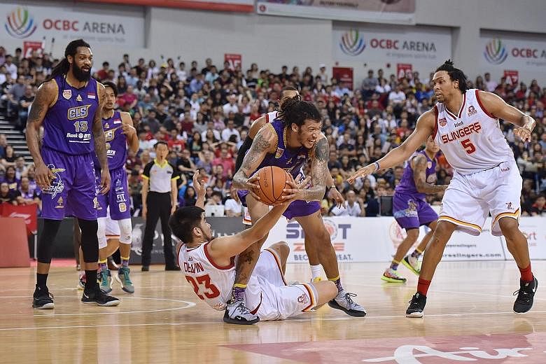 Delvin Goh (on ground) wants the Singapore Slingers to keep fighting until the final buzzer when they face CLS Knights Indonesia in tonight's deciding Game 5 of the Asean Basketball League Finals at the OCBC Arena.