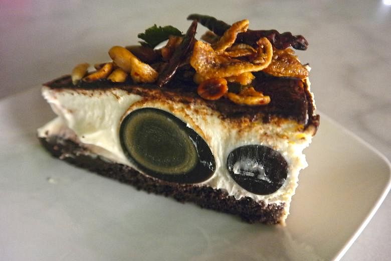 Moody Cow Cafe Penang's Black Moon cheesecake has century egg in the filling and an ikan bilis topping.