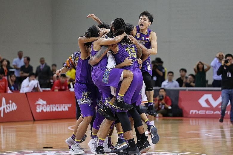 Top: CLS Knights Indonesia celebrate their maiden Asean Basketball League championship win. They beat the Singapore Slingers 84-81 yesterday. ST PHOTO: KEVIN LIM