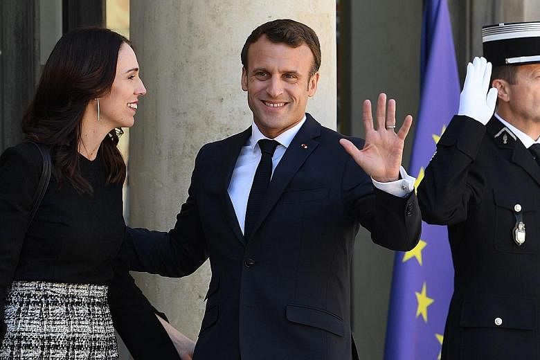 French President Emmanuel Macron welcoming New Zealand Prime Minister Jacinda Ardern in Paris yesterday. PHOTO: AGENCE FRANCE-PRESSE