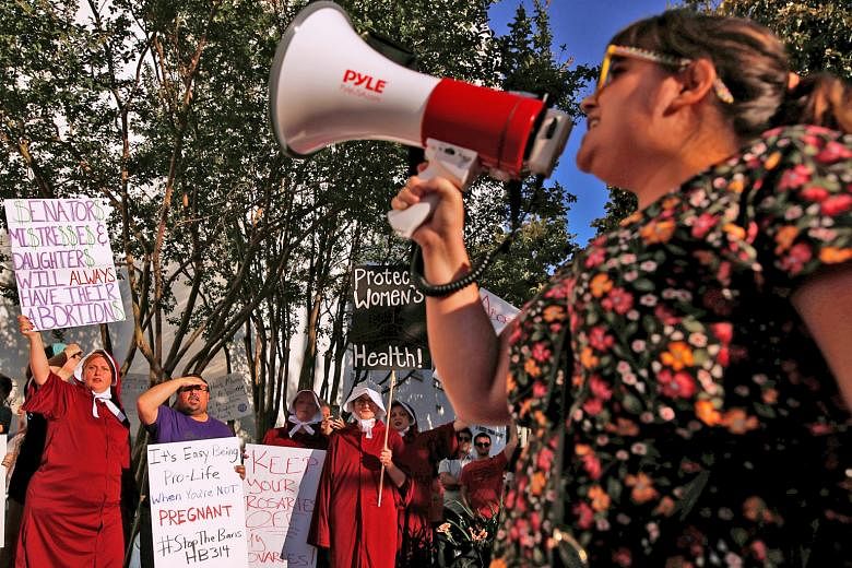Pro-choice supporters protesting in front of the Alabama State House in Montgomery, Alabama, on Tuesday as the state Senate voted on the strictest anti-abortion Bill in the United States.