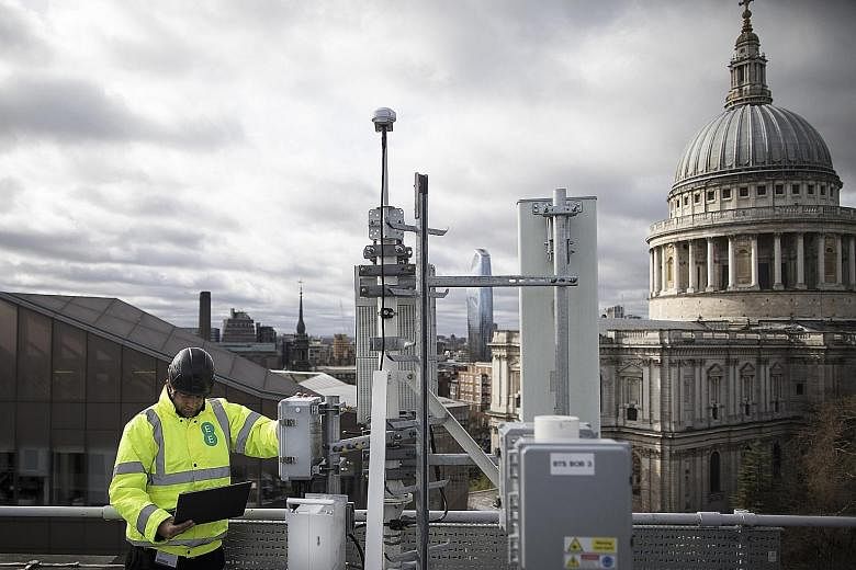 An engineer from British wireless network provider EE checking 5G masts and Huawei 5G equipment during trials in London earlier this year. Huawei has been the leading vendor in supplying 5G network equipment, having secured 40 global contracts.