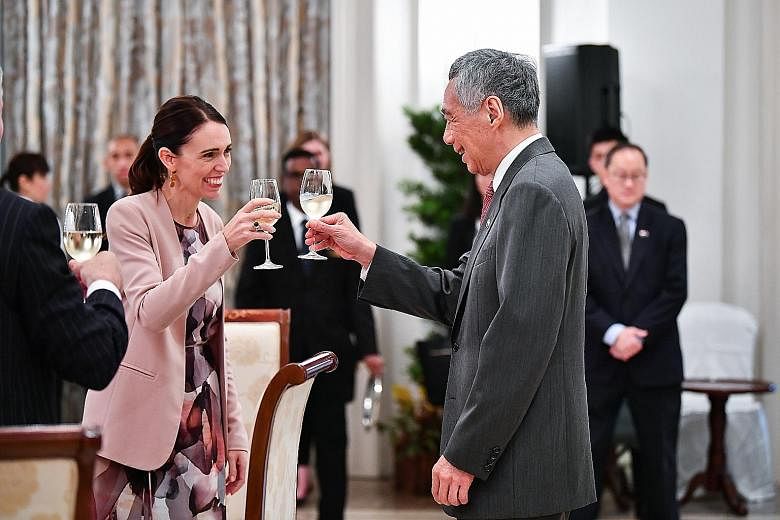 Ms Ardern meeting President Halimah Yacob at the Istana yesterday. With them are (from right) Singapore High Commissioner to New Zealand Bernard Baker; Senior Minister of State for Defence and Foreign Affairs Maliki Osman; Minister for Culture, Commu