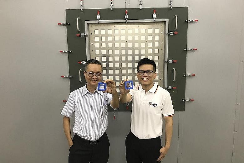 Associate Professor Lee Heow Pueh (left) and doctoral student Ang Yinn Leng Linus with their 3D-printed noise reduction block designed to target low-frequency sounds of 500Hz and lower.