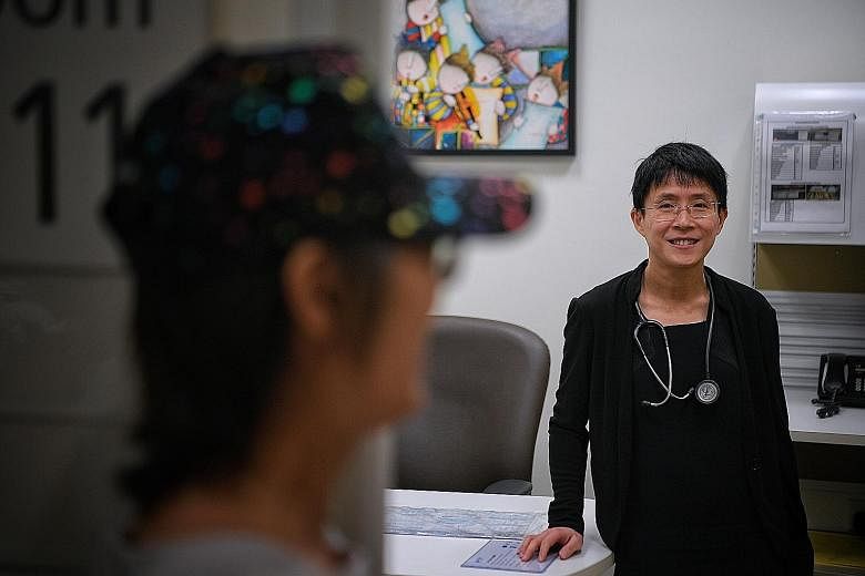 Associate Professor Lee Soo Chin, head of the department of haematology-oncology at National University Cancer Institute, Singapore, with breast-cancer patient Kwok Pui Yee, who started taking the drug last year. Called Olaparib, it kept her cancer u