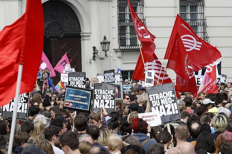 Protesters outside the Vienna office of Austria's Vice-Chancellor Heinz-Christian Strache (above), who is stepping down after being compromised in a sting operation. PHOTO: EPA-EFE