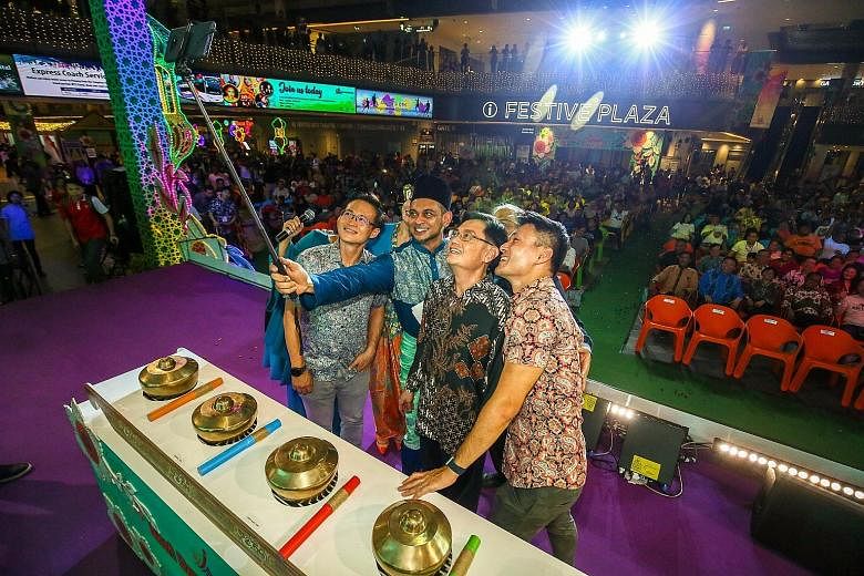 Deputy Prime Minister Heng Swee Keat with his fellow Tampines GRC MPs at the launch of Our Tampines Hub's annual Hari Raya Bazaar yesterday. With him are (from left) Mr Desmond Choo, master of ceremonies Adi Rahman and Mr Baey Yam Keng. Mr Masagos Zu