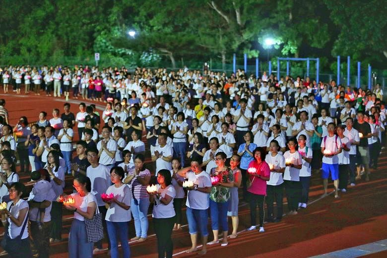 Devotees yesterday performed various rituals, such as "bathing the Buddha" in remembrance of his birth, at Kong Meng San Phor Kark See Monastery in Bright Hill Road, near Bishan, and the "three steps, one bow" rite at Bukit Gombak Stadium (left). In 