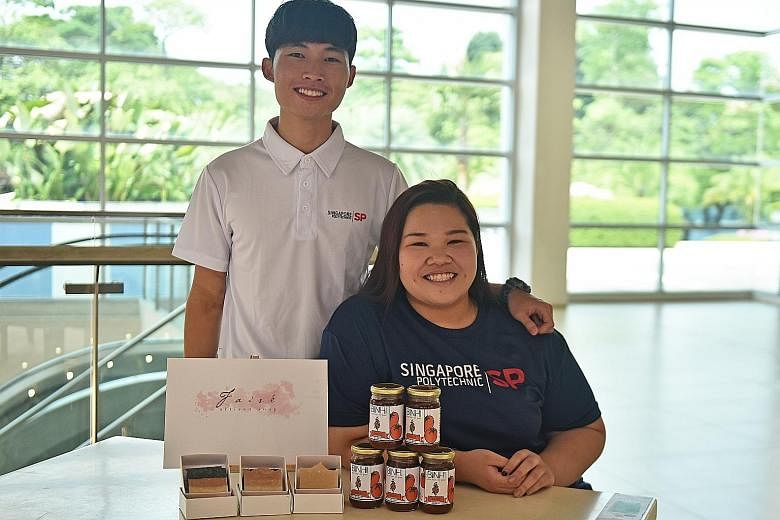 Singapore Polytechnic graduates Sieng Chun Hon, with his team's artisanal soap made using natural ingredients, and Joan Charlotte Tng, with her team's tomato jam that uses natural preservatives.