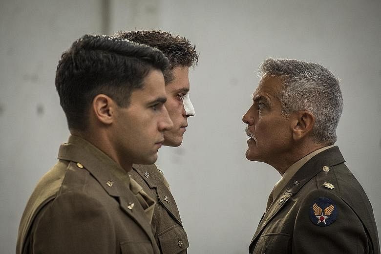 George Clooney's Lieutenant Scheisskopf (far right) glaring at Clevinger, a soldier played by Pico Alexander (with bandage on nose), and Yossarian, played by Christopher Abbott.