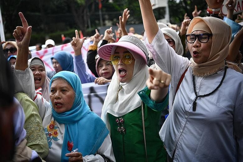Supporters of presidential candidate Prabowo Subianto outside the KPU building on April 21. The Persaudaraan Alumni 212 group has called for a rally to protest against the impending poll results.