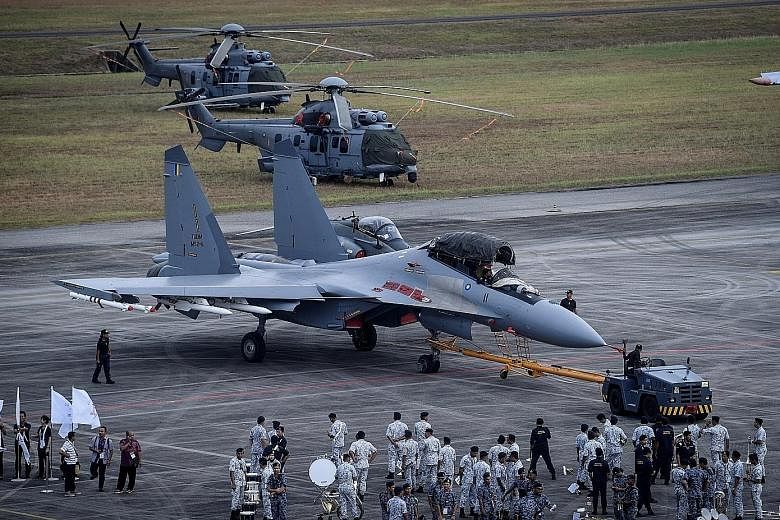 A Sukhoi fighter jet owned by the Malaysian air force on the tarmac at the Langkawi International Maritime and Aerospace Exhibition in March. The planned purchase of 30 light combat aircraft will be the single-largest defence procurement deal under P