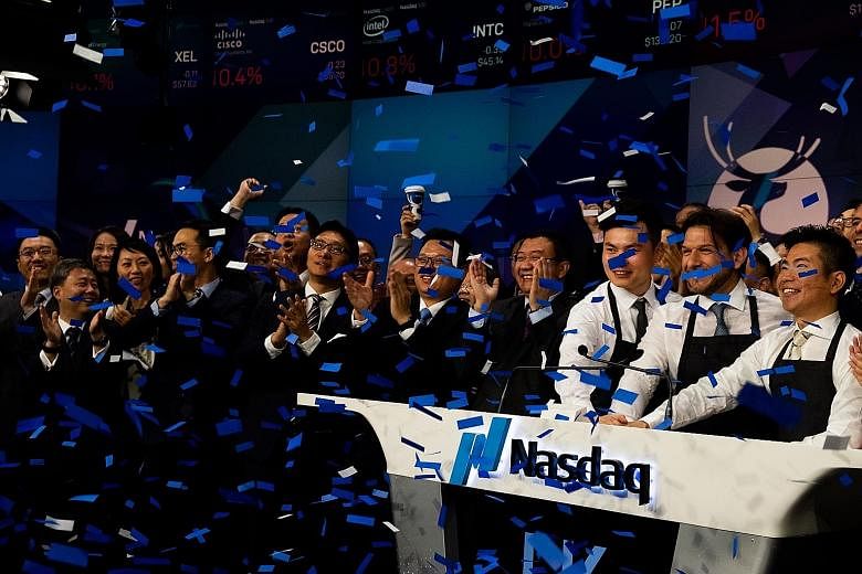 Luckin Coffee employees celebrating during the launch of the company's initial public offering on Nasdaq last week.