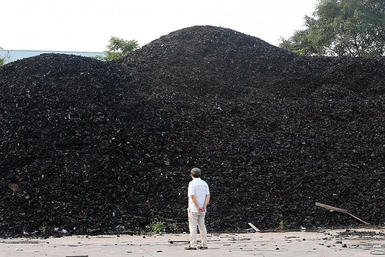 The "rubber hill" comprising scrap rubber materials was once meant for tyre-derived fuel and to be used in power plants and paper mills. PHOTO: LIANHE WANBAO