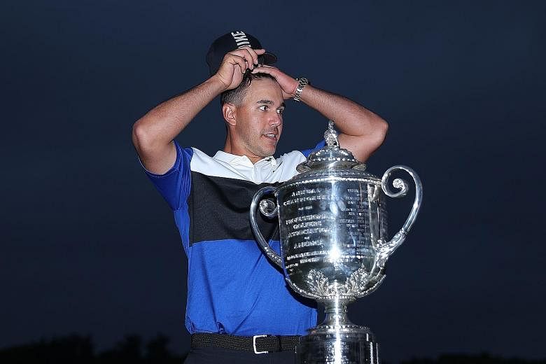 A relieved Brooks Koepka with the Wanamaker Trophy after retaining the PGA Championship at the Bethpage Black Course in Farmingdale, New York on Sunday. Runner-up Dustin Johnson has now finished second at all four Major championships.