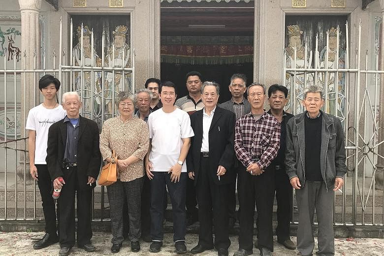 Mr Cyprian Lim (front row, in a white T-shirt) with his relatives in China. Mr Lim embarked on the book project as he was curious about his ancestors' faith and service to the Catholic community. The village of Peknay with its Catholic church. Some 3