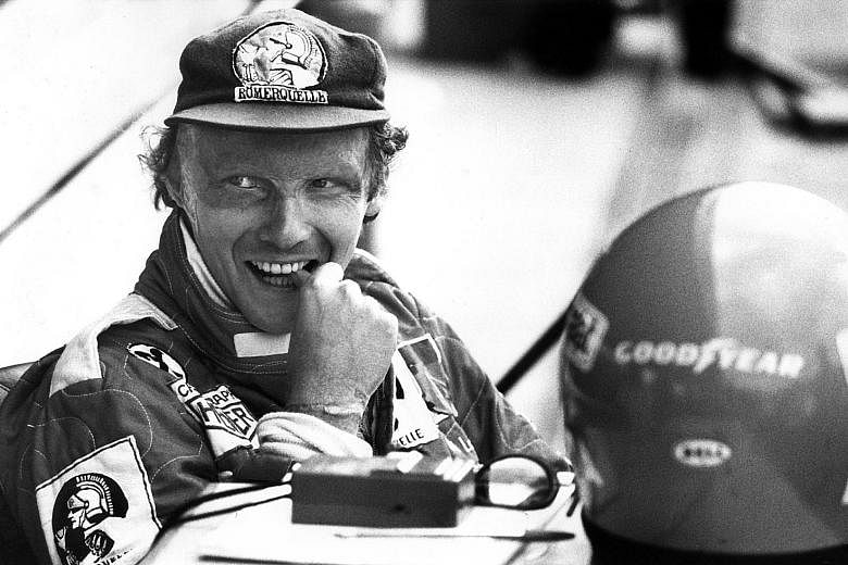 THE RACER: A bubbly Niki Lauda (above) before the 1977 German GP at Hockenheim. He won his second F1 world title that season with Ferrari and would clinch a third with McLaren in 1984. PHOTO: DPA THE MENTOR: Lauda, who returned to F1 in management ro