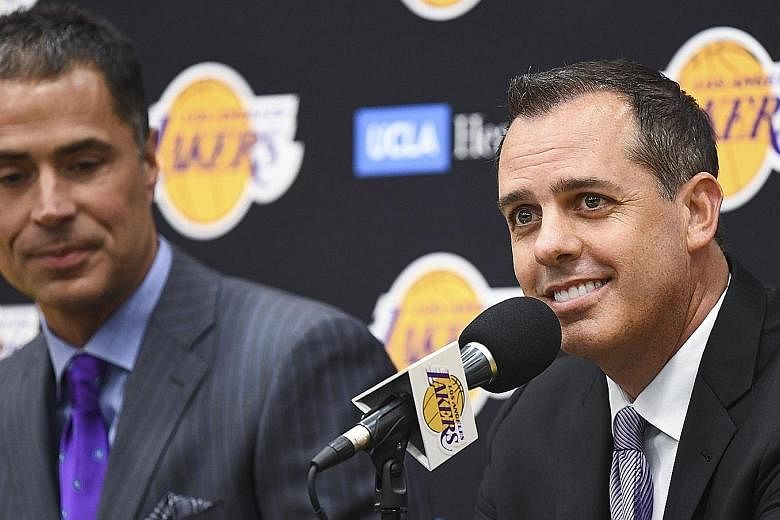 New Los Angeles Lakers head coach Frank Vogel (right, with general manager Rob Pelinka) believes that forging a sense of unity would be crucial as he attempts to halt six years of not making the NBA play-offs. PHOTO: REUTERS