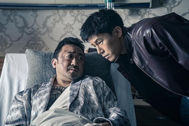 Ma Dong-seok (above left) plays gangster Jang Dong-soo, while Kim Moo-yeol plays cop Jung Tae-suk in The Gangster, The Cop, The Devil.