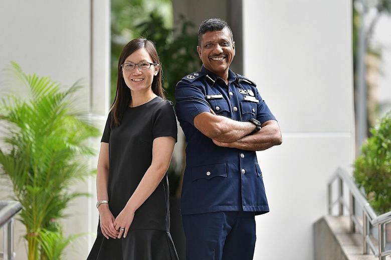Ms Sylvia Liaw from the Ministry of Home Affairs and Senior Assistant Commissioner Arul David Scott were among the 280 Home Team officers promoted at a ceremony yesterday. ST PHOTO: NG SOR LUAN