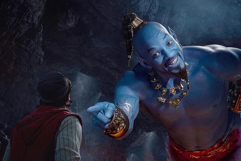 In Aladdin, Mena Massoud (far left) plays the titular character, while Will Smith plays the genie.