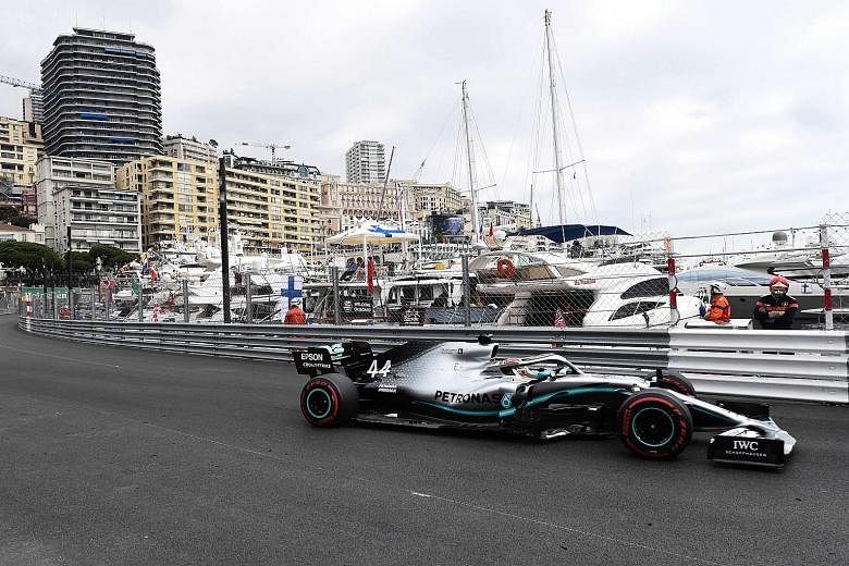 Top: Lewis Hamilton driving his Mercedes around Monaco's harbour during the first practice session, which he topped. Left: The team's simple but poignant thank you to Lauda. Above: The legend is honoured with a red star. PHOTOS: AGENCE FRANCE-PRESSE,