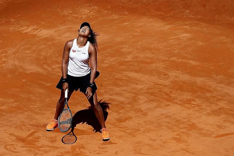 Japan's Naomi Osaka reacting after a poor shot during her second-round match against Slovakia's Dominika Cibulkova at the Italian Open earlier this month. Osaka won 6-3, 6-3 but she had to withdraw from her quarter-final match against the Netherlands