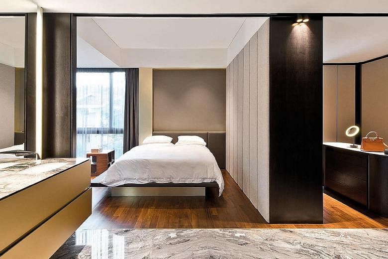 (Left) The master suite features fabric panels, Orobico marble, dark walnut and grey stone. (Above) Well-known furniture pieces dot the living room, such as the Bart Daybed by Bart Schilder and the Love Sofa High Back by Marcel Wanders, both for Mooo