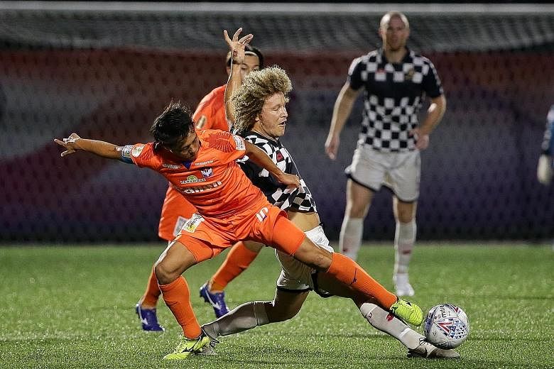 Albirex Niigata's Kyoga Nakamura (far left) had the better of the midfield battle against Brunei DPMM's Blake Ricciuto. But the Singapore Premier League champions were still held 0-0 at their Jurong East Stadium home. ST PHOTO: KEVIN LIM