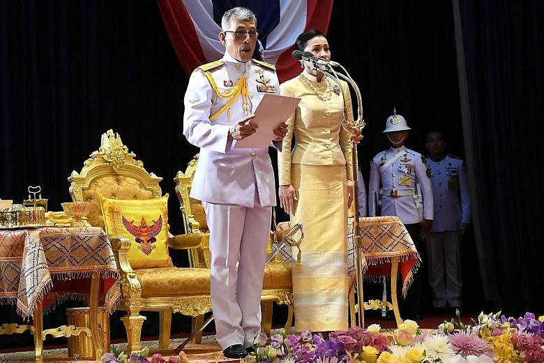 Thailand's King Maha Vajiralongkorn, accompanied by Queen Suthida, presiding over the opening of the first assembly of Parliament at the Ministry of Foreign Affairs in Bangkok yesterday. PHOTO: EPA-EFE