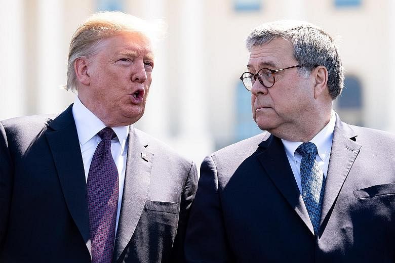 President Donald Trump with Attorney-General William Barr earlier this month. Mr Barr is to launch an investigation into "surveillance activities during the 2016 presidential election". PHOTO: BLOOMBERG