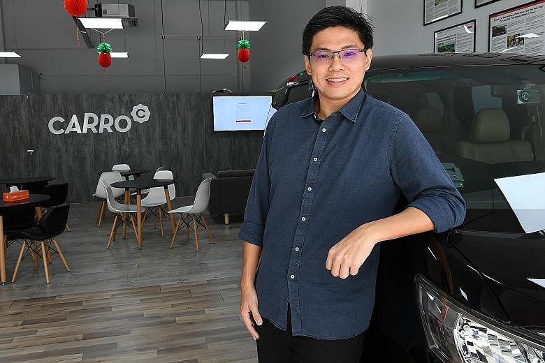 Mr Kelvin Chng, co-founder of Carro, is also involved in an infant clothing distribution and e-commerce business that he started with his wife about seven years ago after they graduated. ST PHOTO: KHALID BABA