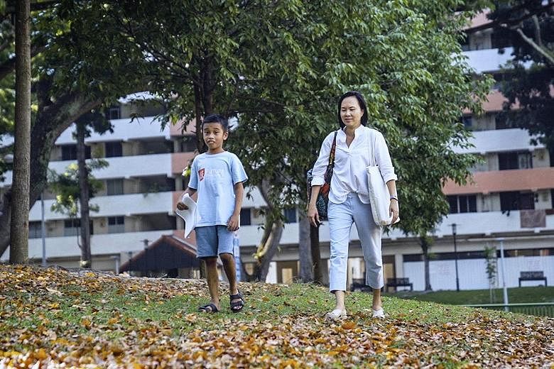 Consultant Lilian Kuan, 49, and her son Ashwin, eight, who has autism. Ms Kuan's efforts to educate Ashwin's teachers about his condition paid off and they were able to support him in class, like letting him take short breaks to draw if he became res