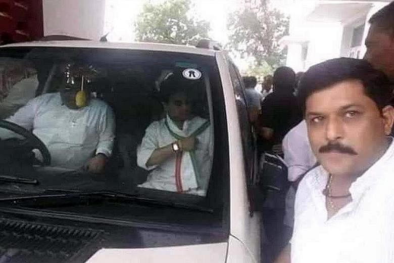 Dr Krishna Pal Yadav (right) of the Bharatiya Janata Party and Mr Jyotiraditya Scindia (in front passenger seat) of the Congress Party in a photo taken years ago by Dr Yadav when he was a Congress worker. PHOTO: @NIKHILANAND2007/TWITTER Senior Congre