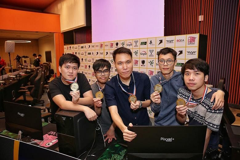 Team X's (from far left) Wilson Koh, Lukman Yusoff, Wong Jeng Yih, Teo Yao Wen and Joel Chan defeated Waacow Warriors 2-0 in the Dota 2 final at Singtel Recreation Club yesterday. They will be nominated by the Singapore E-sports Association for the S